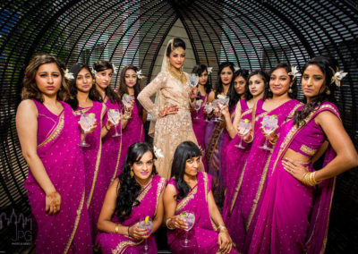 Multicultural Wedding Bride with Bridesmaids inside mesh dome.