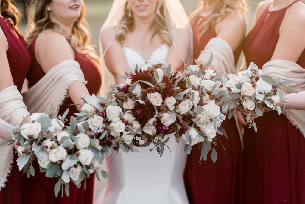 Bride in white and bridesmaids in Burgundy. Amy Cerrato Photography