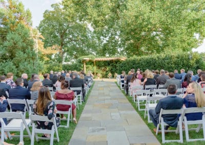 Outdoor wedding ceremony at the Ceremony Garden. Guests seated waiting for wedding ceremony to start.