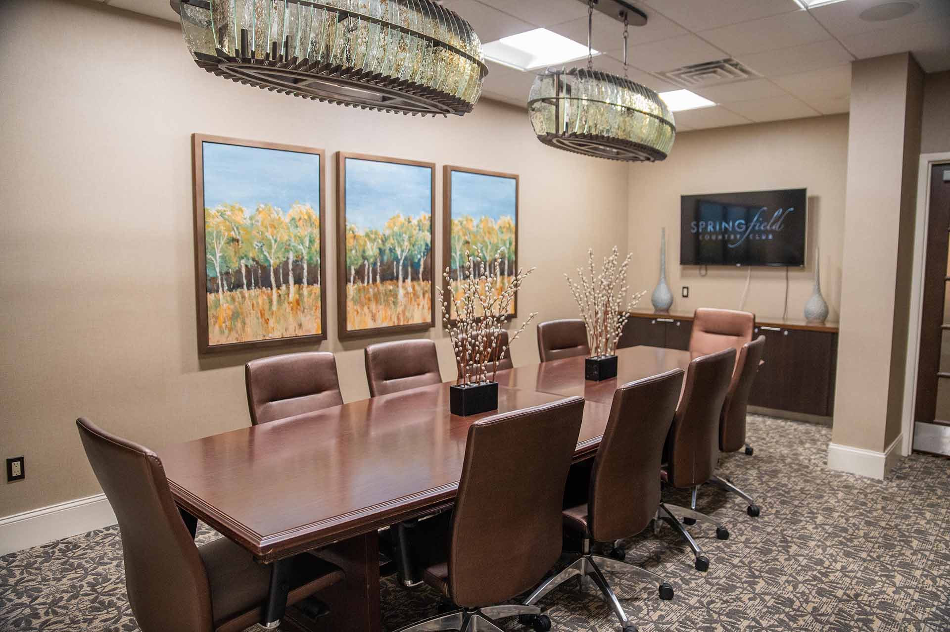 The Commissioner Room with one long table set up for a business meeting.