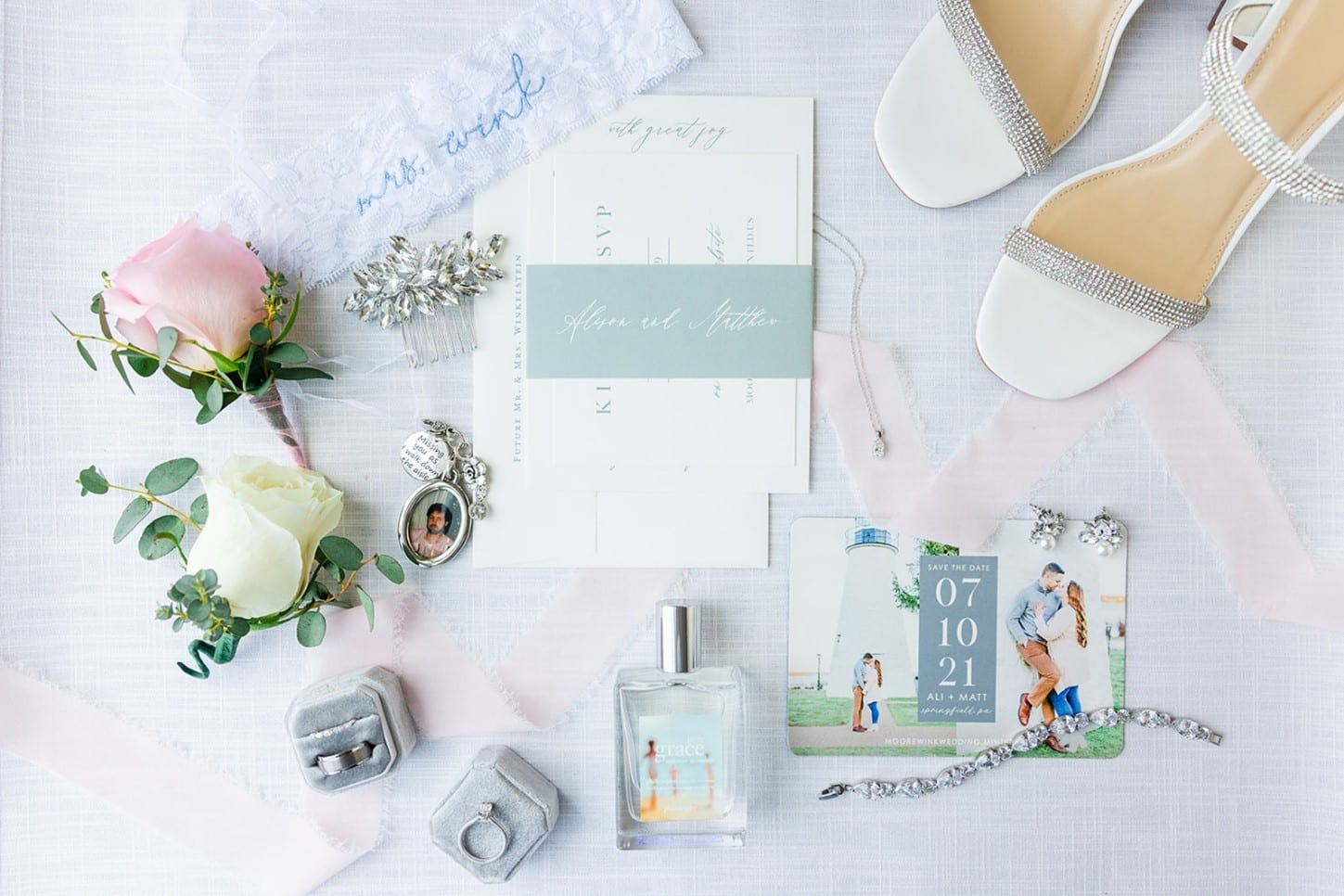 Engagement rings, planner, announcements, shoes, and flowers. Photographed by Chesapeake Charm Photography.