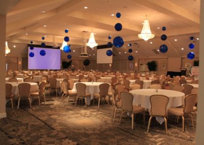 Grand Ballroom set up with projector and blue balloons.