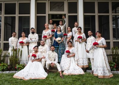 Indian wedding party dressed in traditional white garb