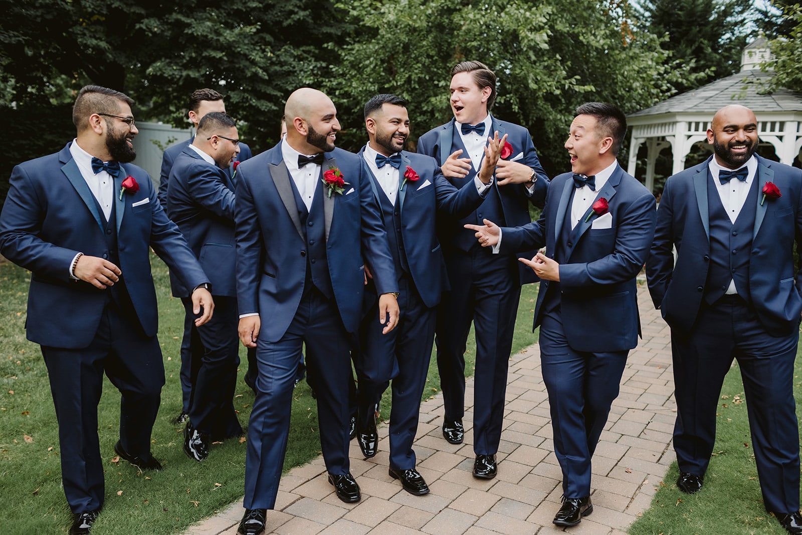 Groomsmen laughing and joking on the way to the wedding. Photo by Justin Johnson Photography.