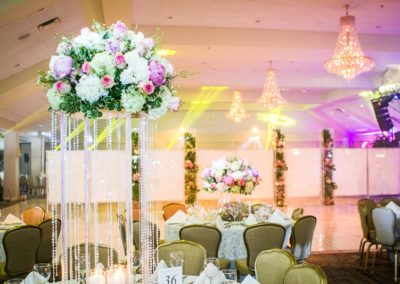 Kosher Wedding Setup with large bouquets of flowers.