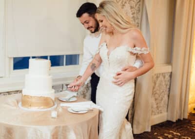 couple cutting wedding cake