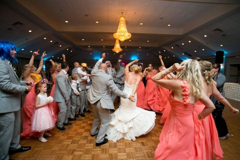 Newly married couple dancing through the ballroom dance floor